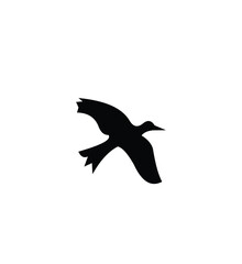 Fototapeta premium Black silhouette of a bird in flight