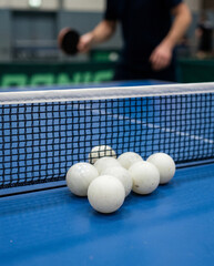 Close Up of Table Tennis Balls Near Net on Ping Pong Table, Sports Equipment and Indoor Game Competition Concept