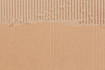 Brown cardboard sheet texture background, pattern of recycle paper box with old vintage and ripped edges.