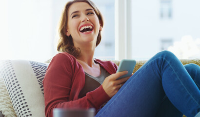Laugh, digital and woman in living room with phone, online communication and comic post on social media. Happy, comedy or female person in house with tech, meme reaction or funny response on chat app