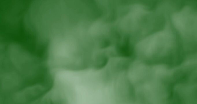 smoke slowly floating through space against chroma key green screen