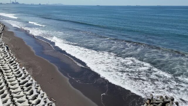 Aerial view of the breakwater from above at Kemiren Beach, Cilacap, 4K