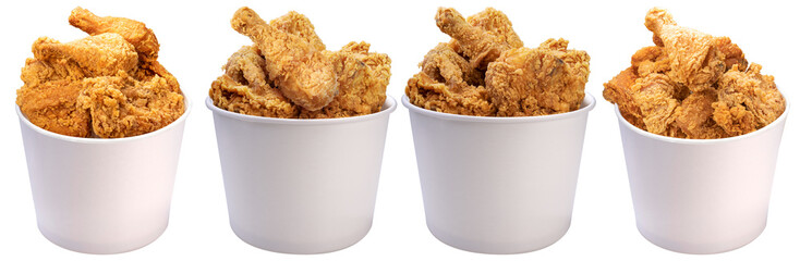Delicious photograph of crispy fried chicken pieces in white buckets, on a transparent background. © Food and Drink