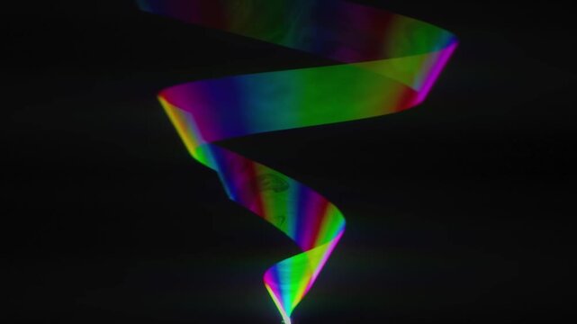 An abstract colorful background design featuring vibrant rainbow wave lines and glowing light patterns that create a sense of motion and energy against a dark blue fractal texture