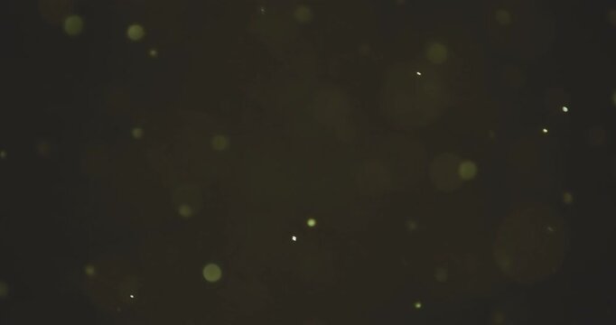 christmas golden glittering background floating with bokeh, gold holiday happy new year festive
