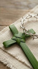 Palm Sunday Cross and Crown of Thorns on Rustic Fabric.