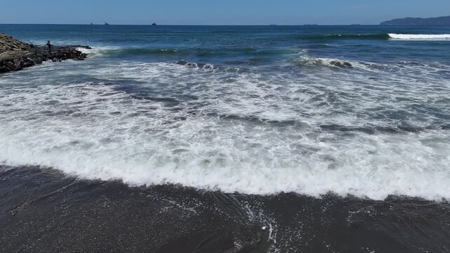 Aerial view of the breakwater from above at Kemiren Beach, Cilacap, 4K