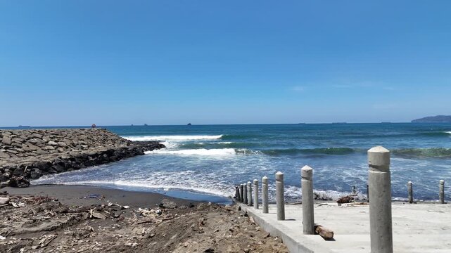 Aerial view of the breakwater from above at Kemiren Beach, Cilacap, 4K