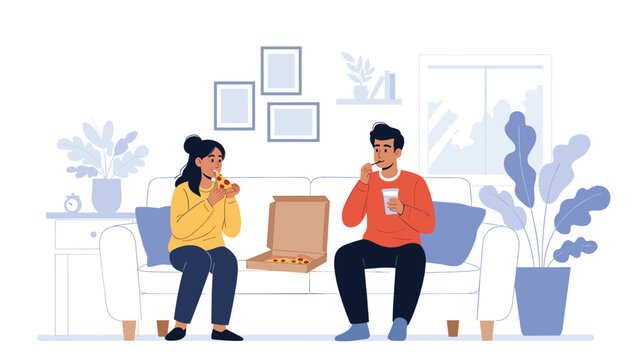 Young couple enjoys a casual meal together while sitting on a comfortable white sofa and eating delicious pizza from a cardboard box.