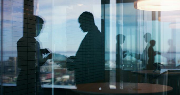 Silhouette, b2b and reflection with business people in office for planning, meeting or realtor advisor. Collaboration, discussion and window with employees for partner, support and property developer