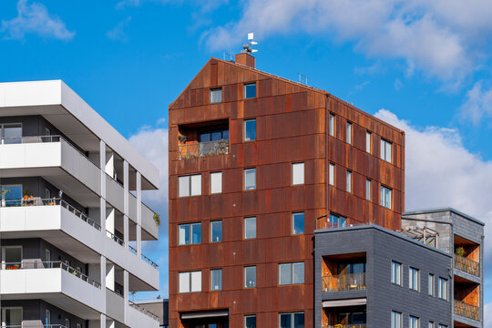 Modern apartment building architecture with facade texture against blue sky in Stockholm Sweden Djurgardsstaden captured in crisp daylight