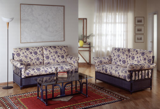 Single shot photo of a room with a rattan sofa