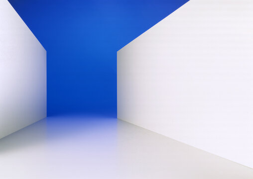 Single shot photo of an abstract environment, with white walls and a blue background