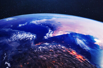 Cinematic satellite view of the Strait of Hormuz and Iran at night, showing glowing city lights and...