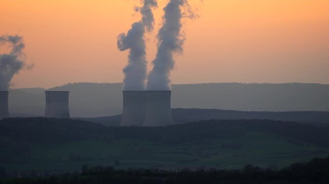 Cattenom Nuclear Power Plant environmental pollution in Moselle region of France, sunset telefoto