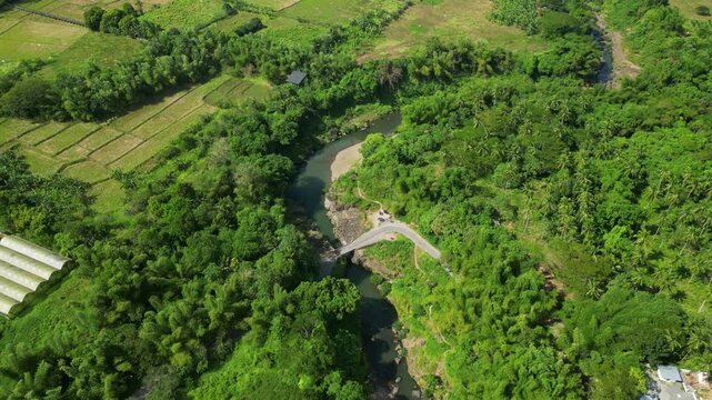 Wide drone landscape of Pantihan Falls and surrounding tropical jungle valley in Maragondon Cavite Philippines.