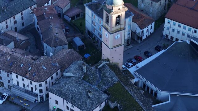 Aerial shot of Morfasso village with church, houses and rural landscape in Piacenza province, Emilia-Romagna region, northern Italy.