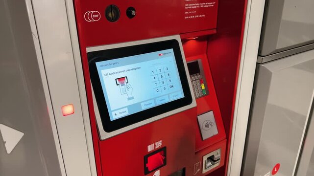 Paid luggage storage at Zurich train station. Contactless access to the luggage room. Europe, Switzerland. girl scans the code for payment