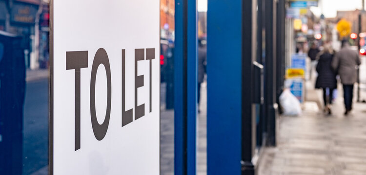 Shop To Let sign on high street window