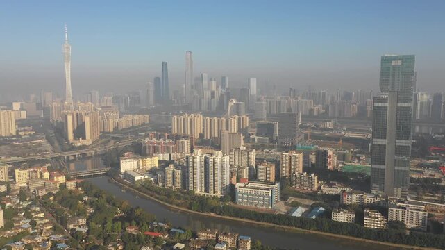 Drone flight of residential flats, commercial buildings, modern office buildings, skyline of Guangzhou city in China