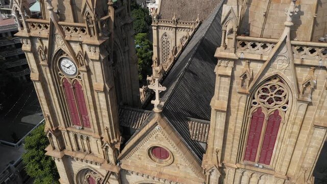 Rising tilting drone shot of famous Sacred Heart Cathedral in Guangzhou, China