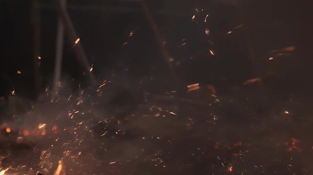 Fireworks explode in a dark night sky with sparks flying everywhere outside