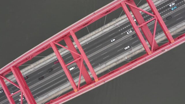Aerial view of highway crossing arch bridge spanning the Pearl River in Guangzhou, China