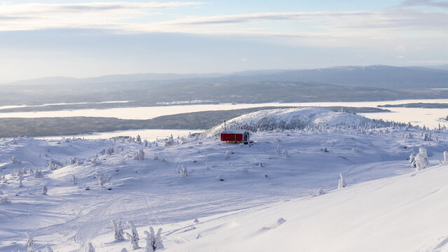 aerial view of snowy hill with mobile house balok