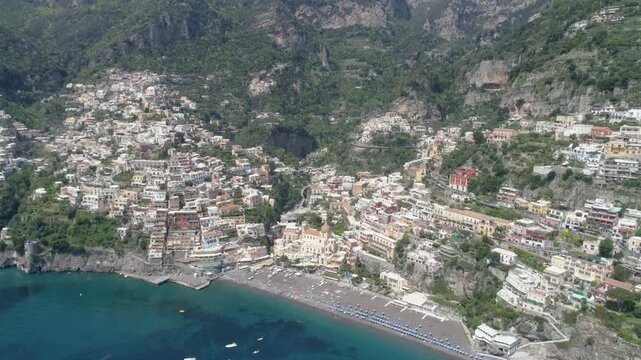 Positano on the Amalfi Coast in southern Italy, colorful cliffside houses above the Tyrrhenian Sea creating iconic Mediterranean travel destination. Aerial View reveals dramatic coastal landscape