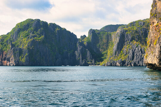 
PALAWAN, PHILIPPINES - DECEMBER 21, 2023: Tropical islands  in El Nido on Palawan Island in the Philippines. 6 million tourists visited Philippines in 2016. On a hot sunny afternoon. Beautiful scener