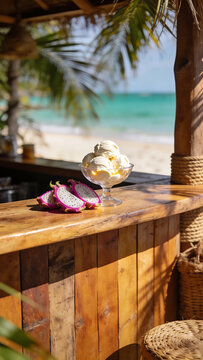 Delicious vanilla ice cream served with fresh dragon fruit slices on a tropical beach bar
