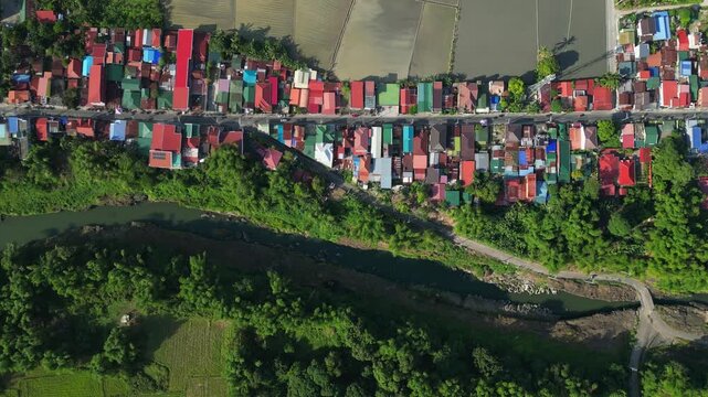 Top view teady shot revealing the river flow, near by houses and the rice field at Bucal Tulay Maragondon Cavite Philippines