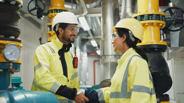 Supervisor and engineer conclude a site inspection with a handshake, formalizing corrective actions and next steps.