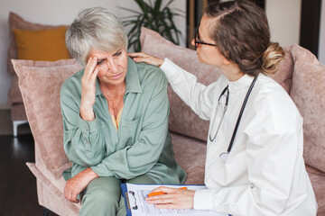 Female nurse doctor caretaker assisting happy senior grandma healthcare homecare concept