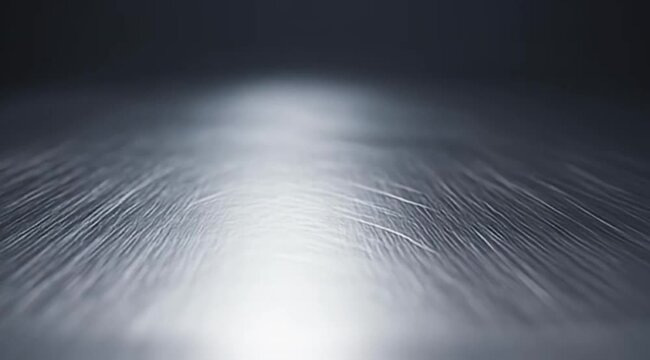Abstract smooth metal surface with fine lines and subtle light gradient