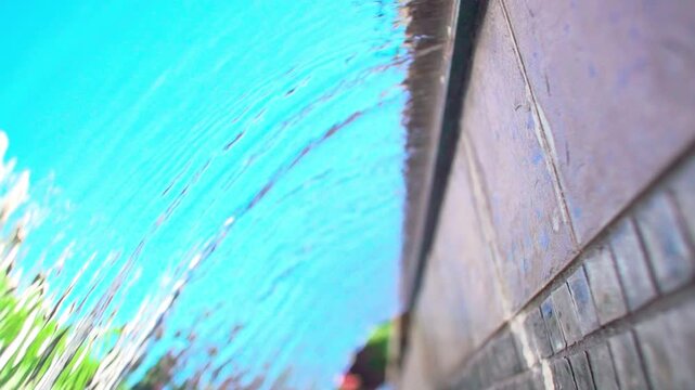 A slow-motion view of a scupper waterfall