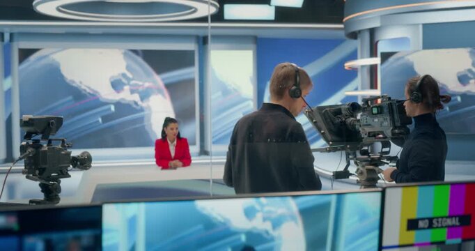 Backstage TV Station Production Control Room Captures Crew Cueing Cameras, Signaling Countdowns, Framing Anchor, Checking Monitoring Program, Preview, Signal Screens to Launch a Live News Broadcast