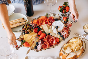 Elegant Charcuterie Board With Cheese, Cured Meats and Fruit for Casual Wine Gathering
