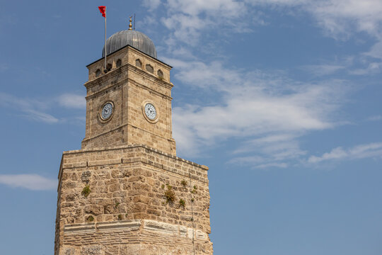 The mosque of Tekeli Mehmet Pasha. The city Mosque in Antalya. The old quarters in the Kaleici area. Turkish mosque. The clock on the ancient tower.