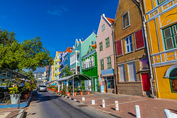 Obraz premium A view down the Handelskade in the Punda District of Willemstad, Curacao on a bright day