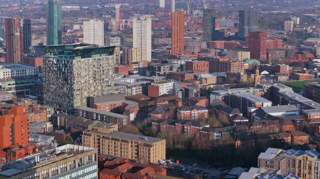 Aerial video of Birmingham&rsquo;s Westside district during golden hour, featuring modern glass skyscrapers, and the city skyline under a warm, late afternoon sky. 