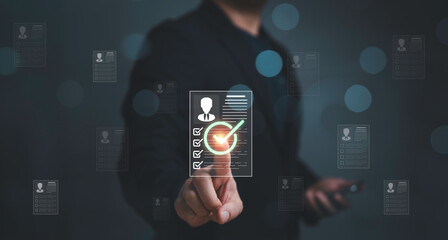 Fototapeta premium Business professional selecting candidate profile checklist for recruitment and HR evaluation process. Concept of talent hiring decision, human resources management, and employee screening candidate.