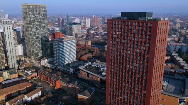 Aerial video of Birmingham&rsquo;s Westside district during golden hour, featuring modern glass skyscrapers, and the city skyline under a warm, late afternoon sky. 