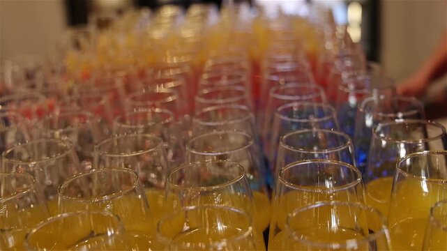 Bartender prepares a colorful cocktails at a party, mixing vibrant ingredients to create a refreshing drink that adds energy, fun, and great vibes to the celebration