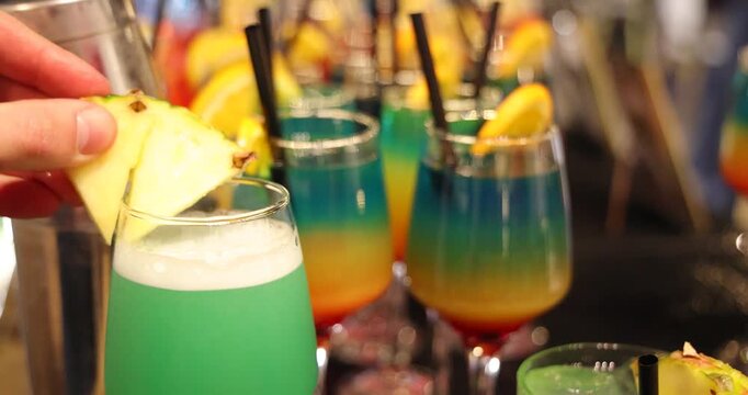 Bartender prepares a colorful Melon Refreshing cocktail at a party, mixing vibrant ingredients to create a refreshing drink that adds energy, fun, and great vibes to the celebration, slow motion