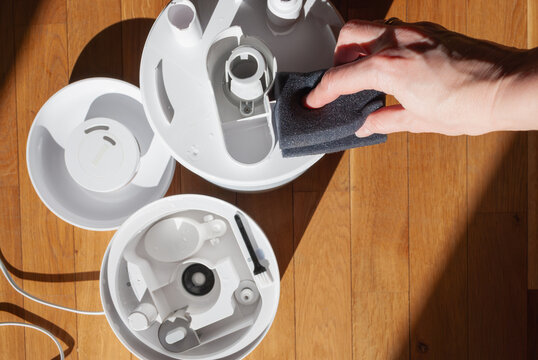 Washing and cleaning parts of air humidifier for better indoor air quality