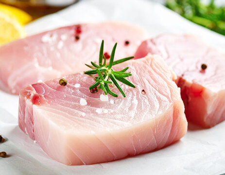 Raw swordfish steak filets, macro shot. AI