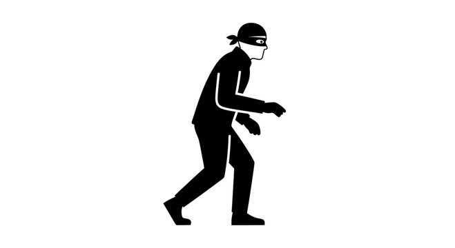 Silhouette of a thief in a mask, sneaking stealthily in the dark, crime concept