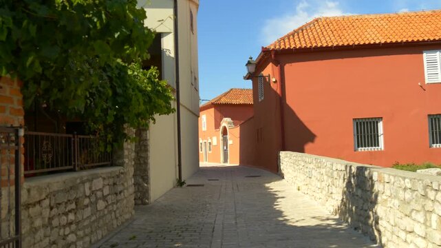 Mediterranean alley with stone walls and houses in Croatia
