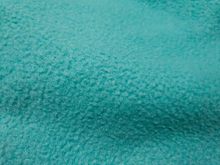 Teal Fleece Fabric Texture Background with Soft Fiber Detail and Gentle Folds, Abstract Textile Surface Flat Lay © prawira